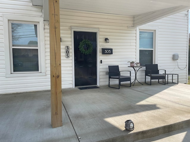 property entrance with covered porch