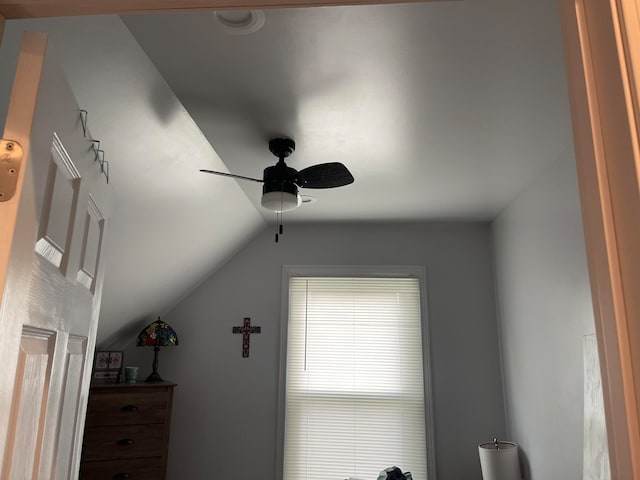 interior space with lofted ceiling and ceiling fan