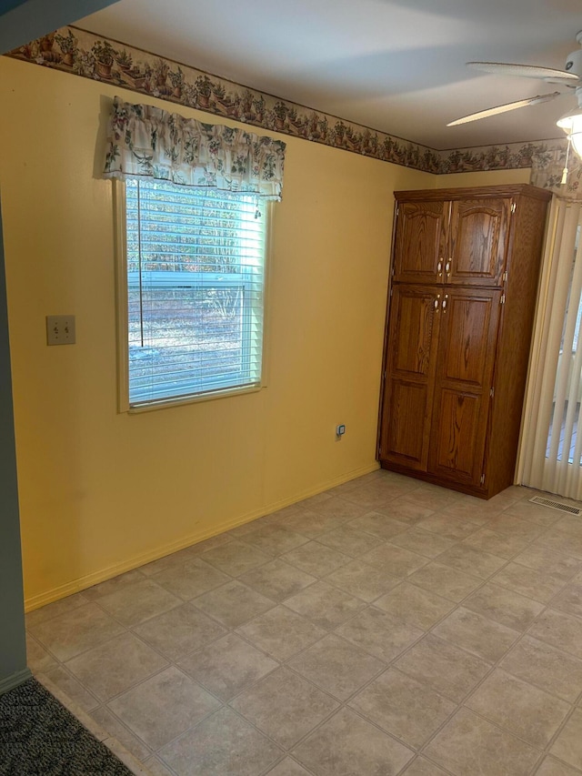 unfurnished bedroom featuring ceiling fan