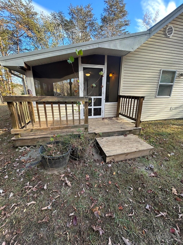 doorway to property with a deck