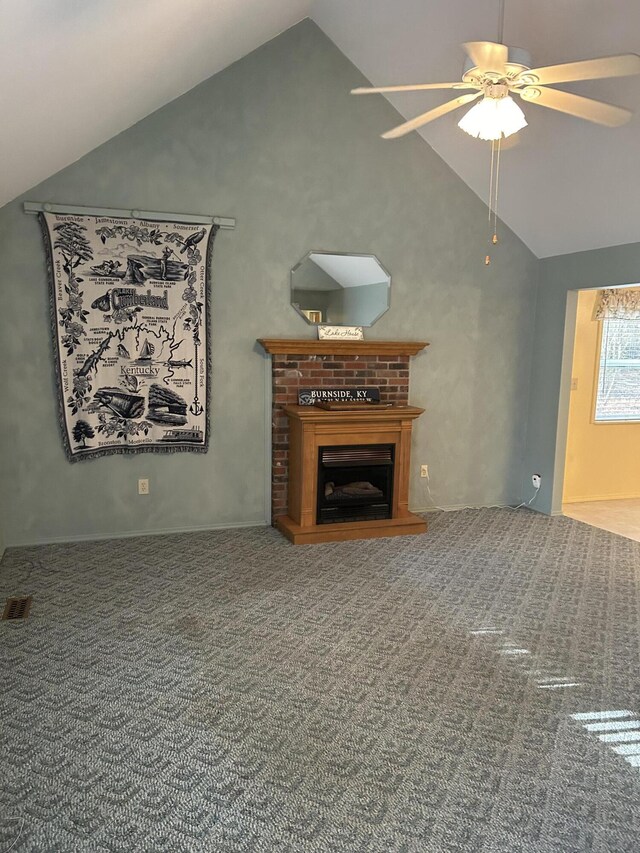 unfurnished living room featuring a ceiling fan, high vaulted ceiling, carpet, and a fireplace