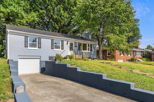 single story home featuring a garage, brick siding, driveway, a chimney, and a front yard