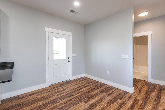 foyer with dark wood-type flooring