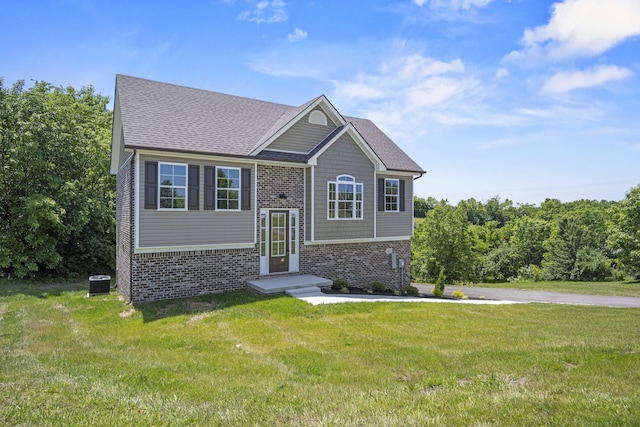 1814 Adkinson Dr, Richmond, KY 40475 - raised ranch with brick siding, a front yard, cooling unit, and a shingled roof