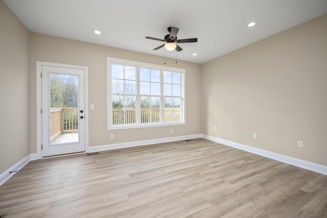 unfurnished room with ceiling fan and light hardwood / wood-style floors