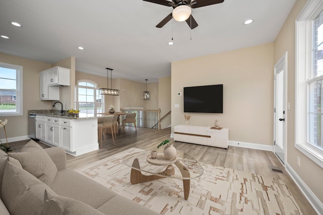 1814 Adkinson Dr, Richmond, KY 40475 - living area with light wood finished floors, ceiling fan, recessed lighting, and baseboards