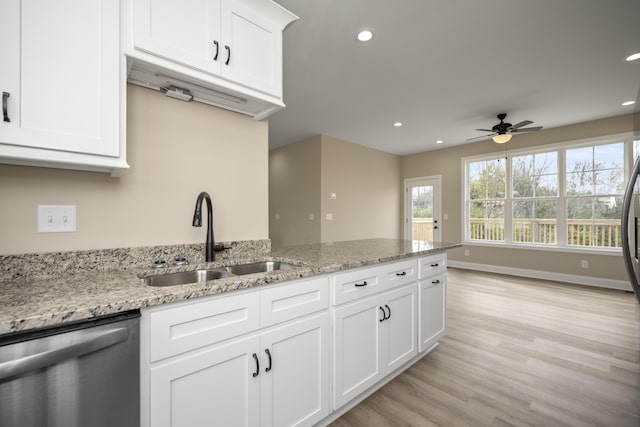 kitchen with dishwasher, sink, ceiling fan, light hardwood / wood-style floors, and white cabinetry