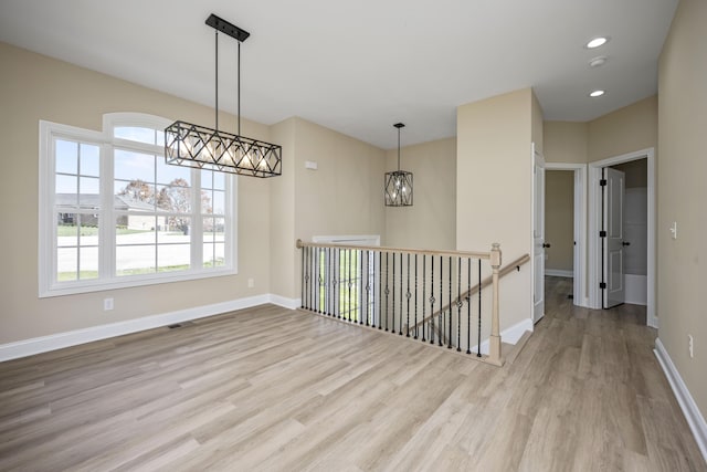 1814 Adkinson Dr, Richmond, KY 40475 - spare room with a chandelier, wood finished floors, plenty of natural light, baseboards, and recessed lighting