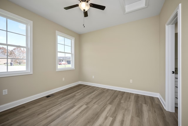 empty room featuring ceiling fan and light wood-type flooring