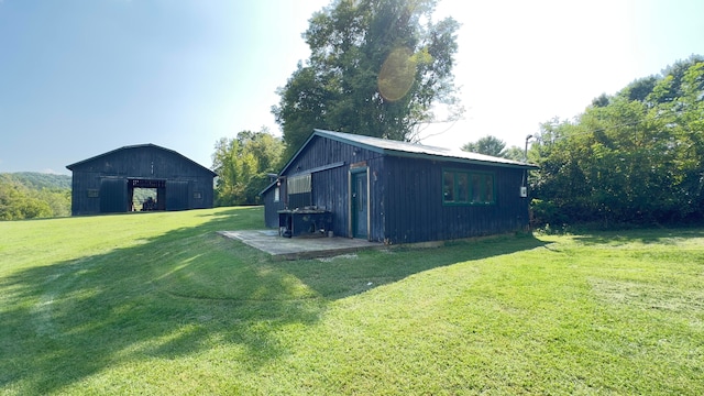 view of outbuilding with a yard