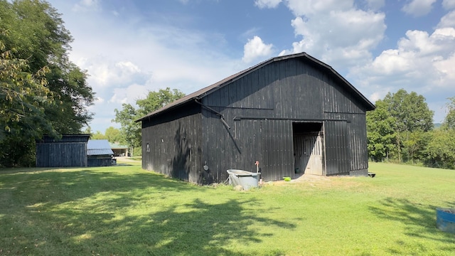 view of outdoor structure with a lawn