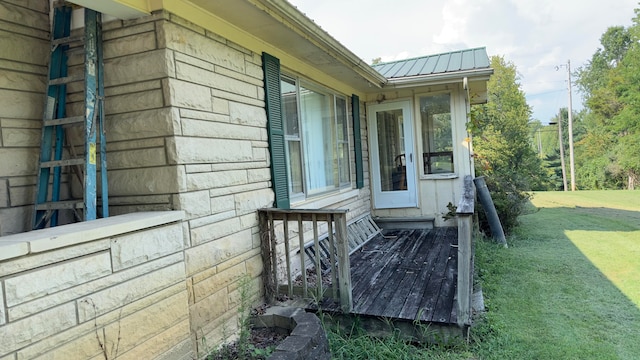 view of side of home featuring a lawn