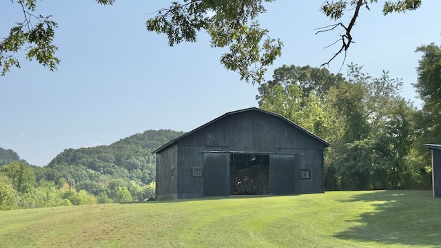 view of outbuilding with a lawn