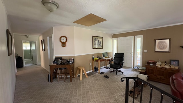 carpeted home office with a textured ceiling