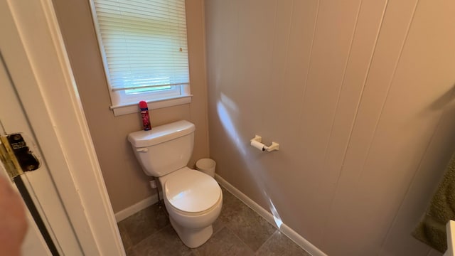 bathroom with tile patterned flooring and toilet