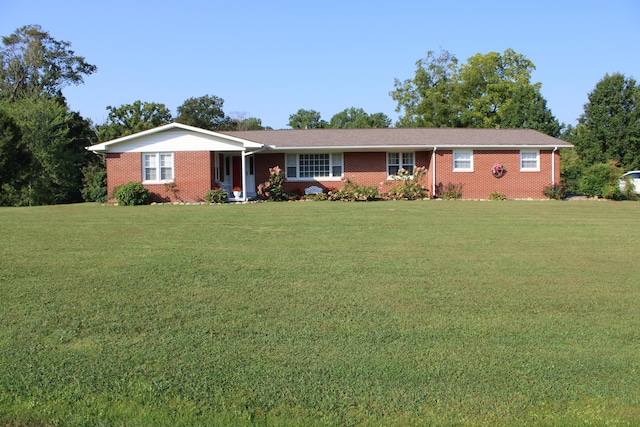 ranch-style home with brick siding and a front lawn