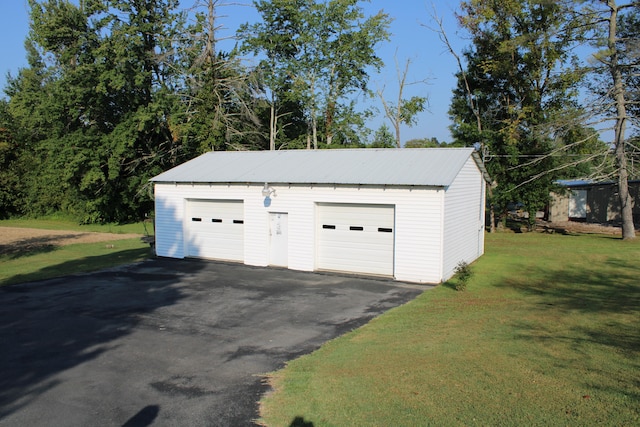 garage with a yard