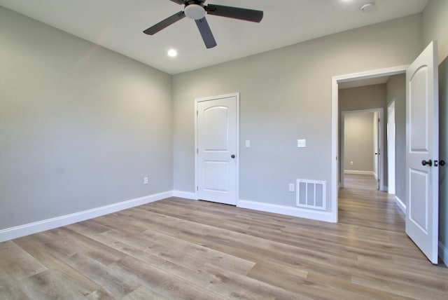 unfurnished bedroom with ceiling fan and light wood-type flooring