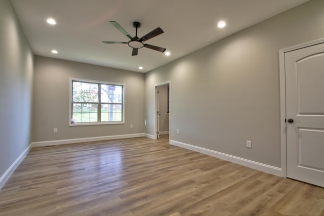 unfurnished room with ceiling fan and light hardwood / wood-style floors