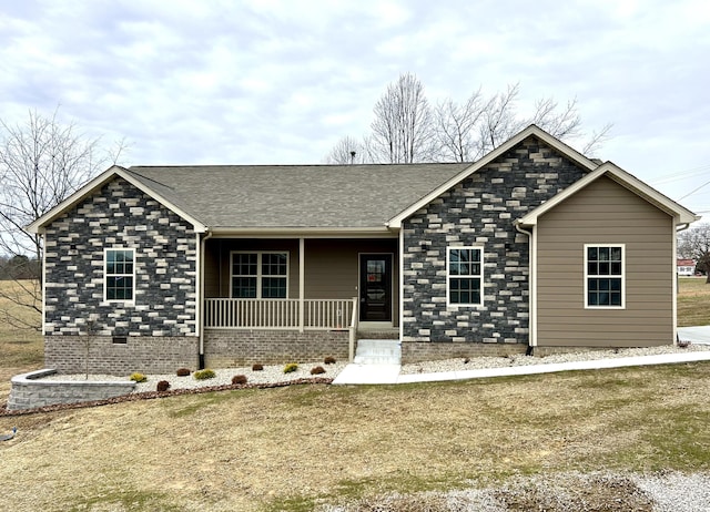 single story home with a porch and a front yard