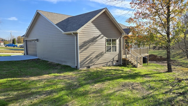 view of home's exterior with a garage, cooling unit, and a lawn