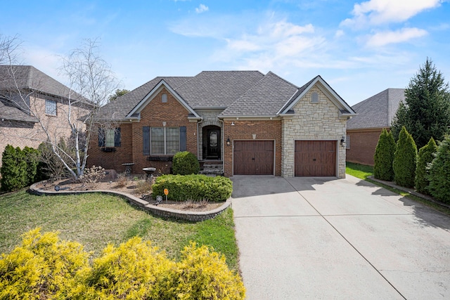 view of front of home featuring a garage and a front yard