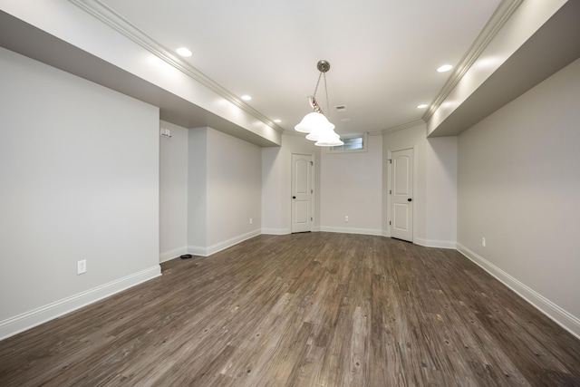 spare room with ornamental molding, recessed lighting, dark wood-style flooring, and baseboards