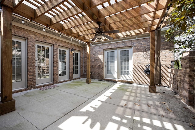 view of patio featuring a ceiling fan and a pergola