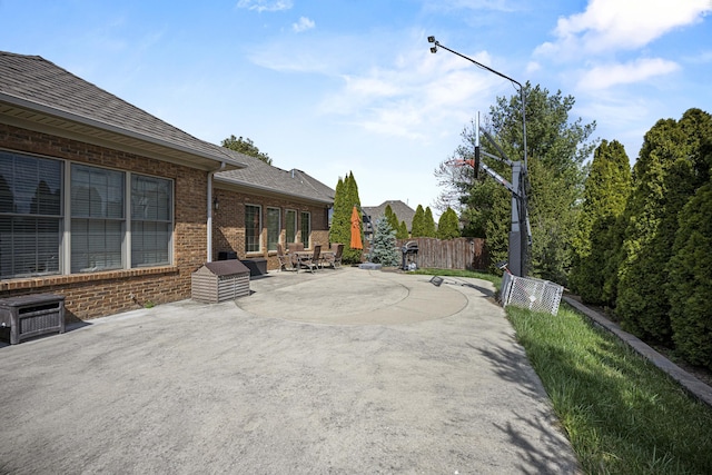 view of patio featuring fence