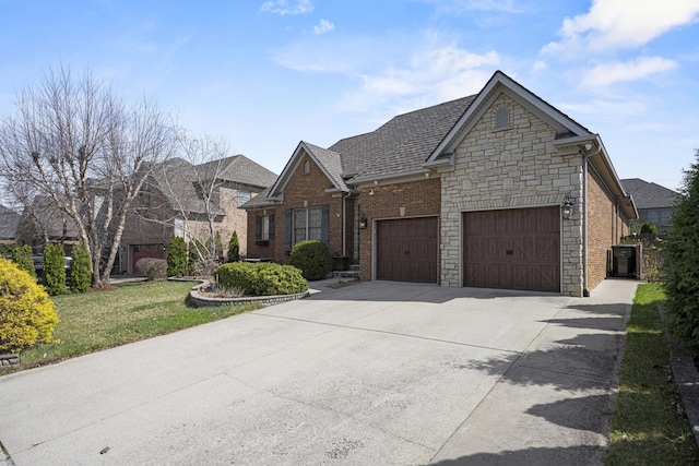 view of front of property with an attached garage, brick siding, a shingled roof, concrete driveway, and a front yard