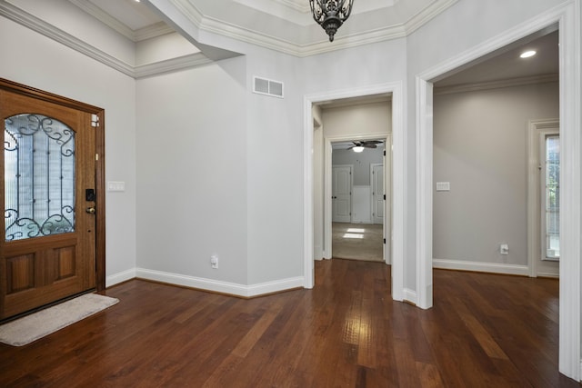 foyer with recessed lighting, visible vents, baseboards, wood-type flooring, and crown molding