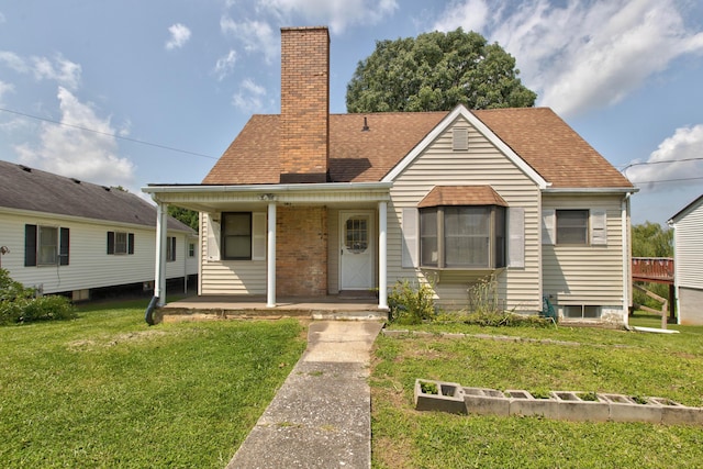 bungalow-style house with a front lawn, a chimney, a porch, and a shingled roof