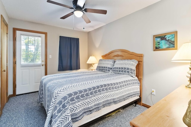 carpeted bedroom with a ceiling fan and baseboards