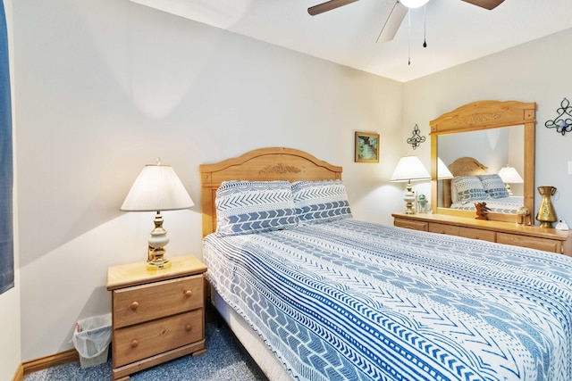 carpeted bedroom with baseboards and ceiling fan