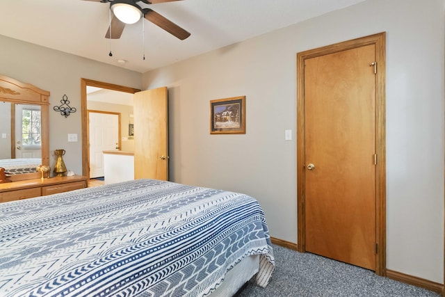 bedroom with ceiling fan, baseboards, and carpet