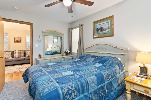 bedroom with ceiling fan and wood finished floors