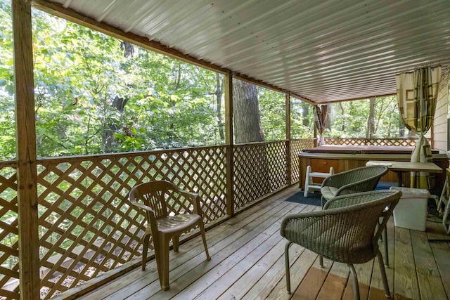 wooden terrace with a hot tub