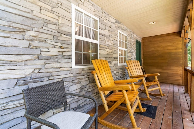 wooden deck featuring covered porch