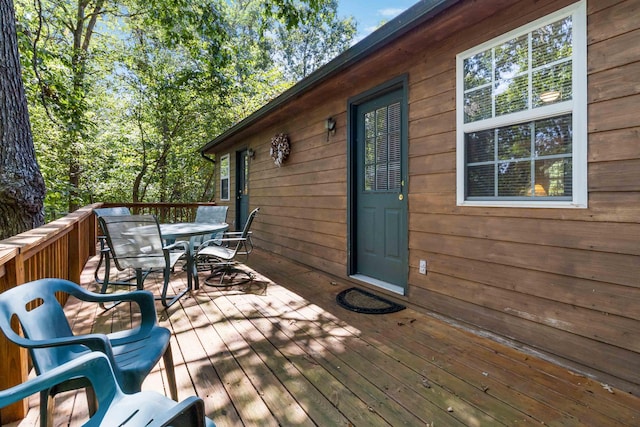 wooden deck with outdoor dining area