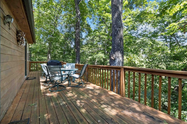 deck featuring outdoor dining area