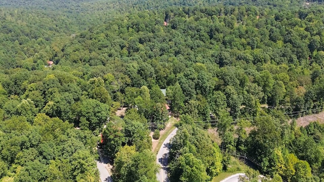 birds eye view of property with a view of trees