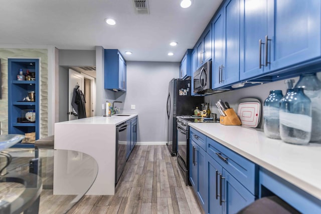 kitchen featuring light hardwood / wood-style flooring, sink, black dishwasher, stove, and blue cabinets