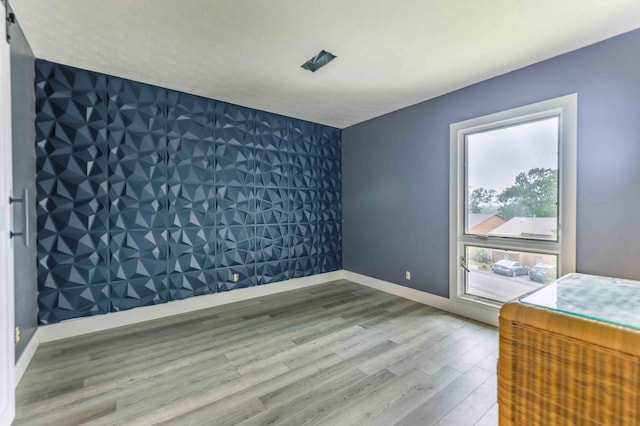 bedroom with hardwood / wood-style flooring