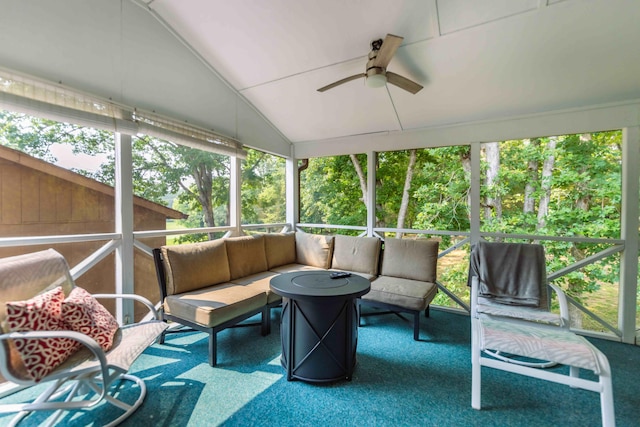 sunroom / solarium featuring ceiling fan, plenty of natural light, and vaulted ceiling