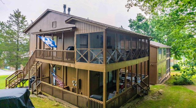 back of property with a sunroom