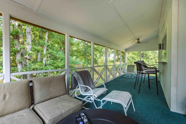 sunroom / solarium featuring vaulted ceiling and ceiling fan