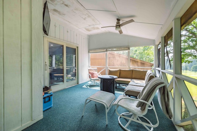 sunroom / solarium featuring ceiling fan and vaulted ceiling