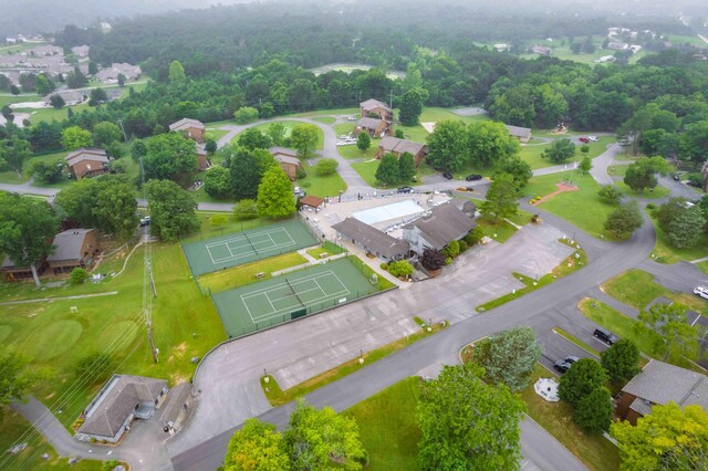 birds eye view of property with a water and mountain view