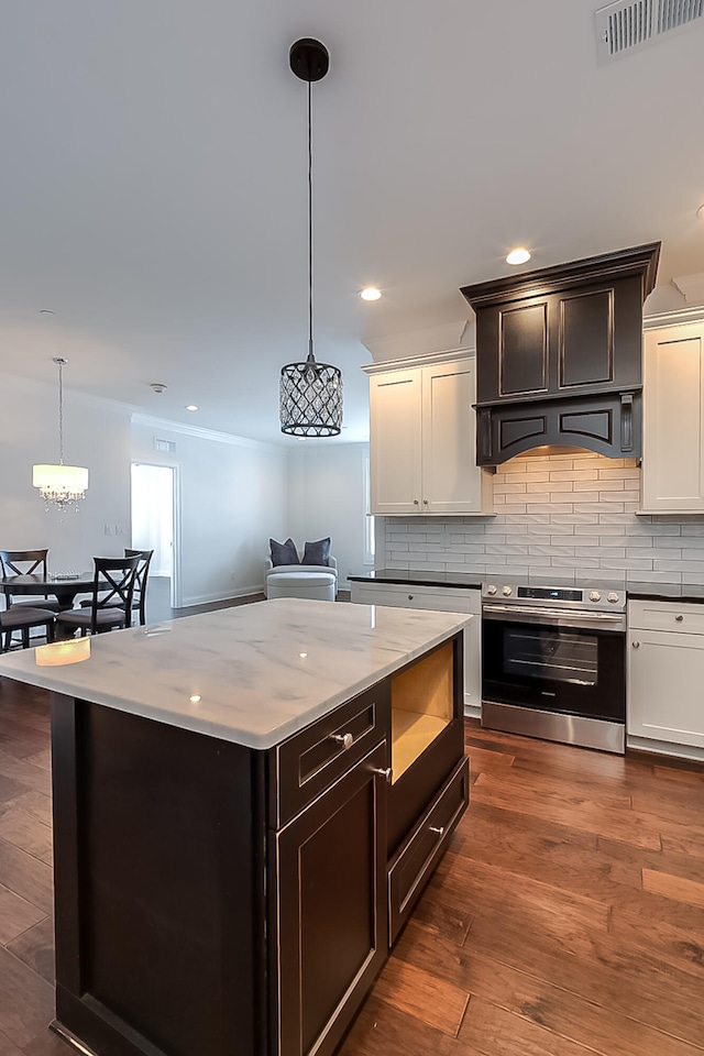 kitchen featuring tasteful backsplash, pendant lighting, dark wood-type flooring, and stainless steel range with electric stovetop