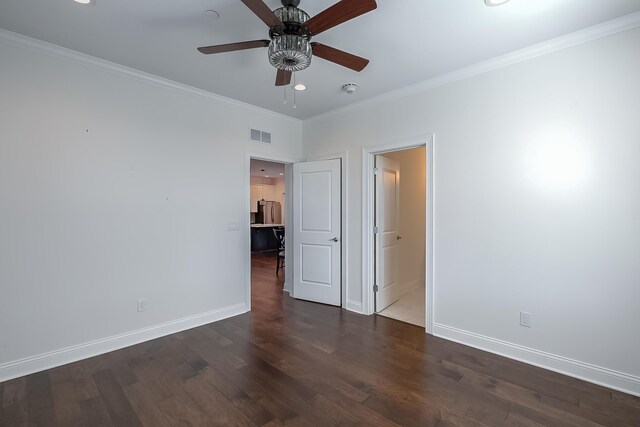 unfurnished bedroom featuring ceiling fan, crown molding, and dark wood-type flooring